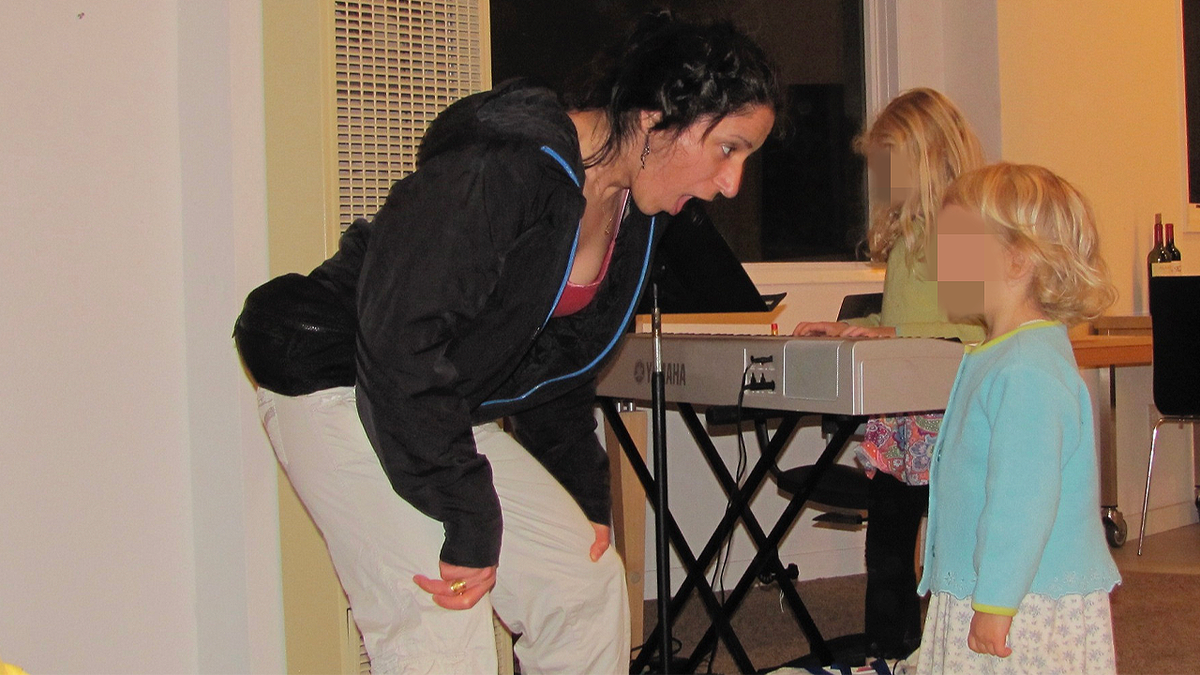 Haleh Abghari teaching children music during a lesson in Colorado Springs