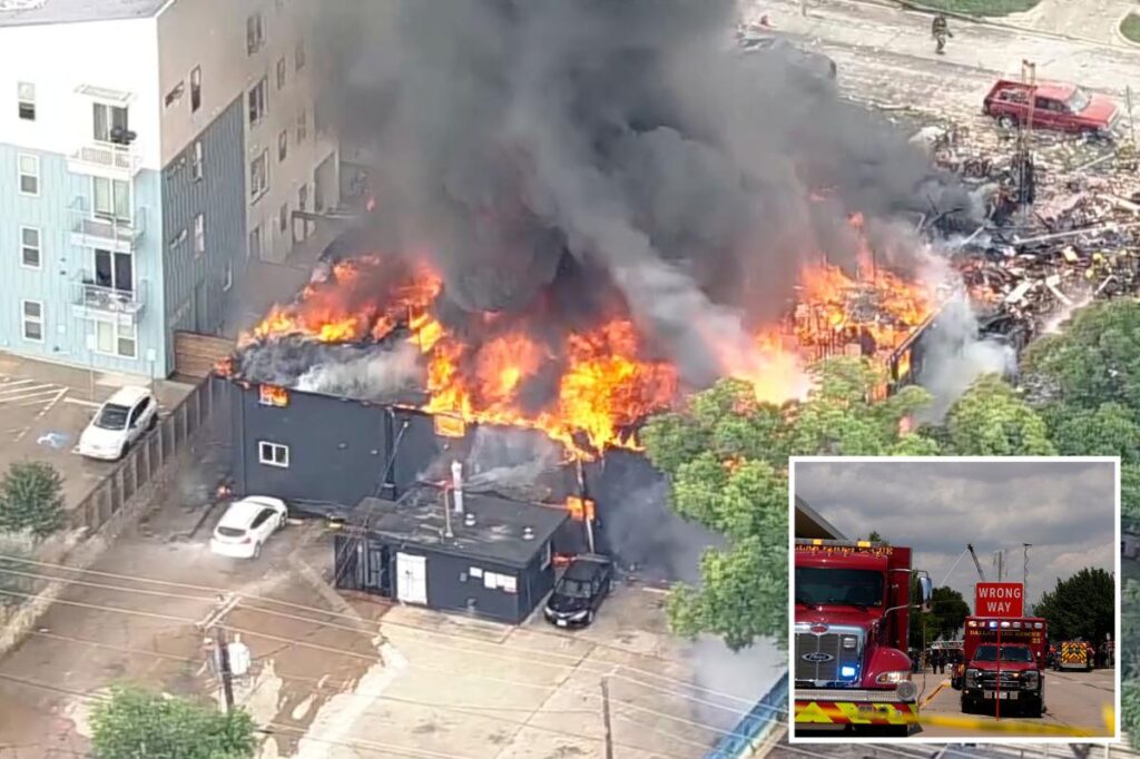 Large fire erupts at Dallas apartment complex and engulfs building