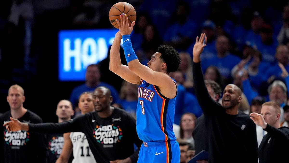 Oklahoma City Thunder guard Jared McCain shooting a three-pointer in a basketball game.
