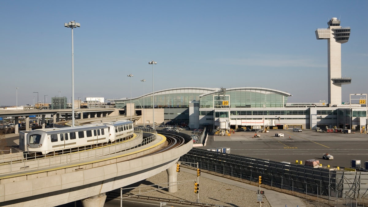 International terminal, train, and control tower at John F Kennedy Airport in New York