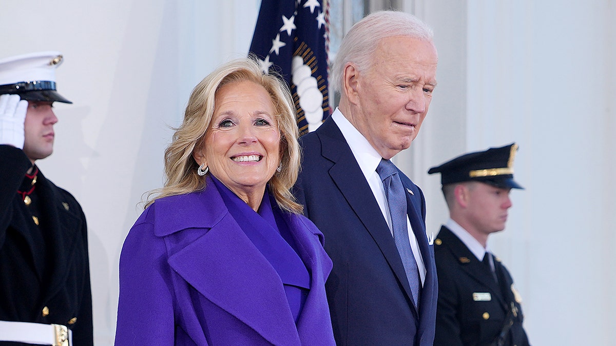 First lady Jill Biden and President Joe Biden standing outside the White House