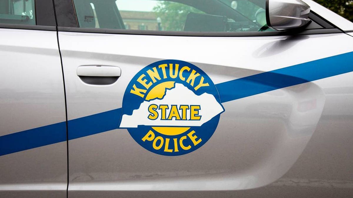 Kentucky State Police logo on cruiser vehicle.