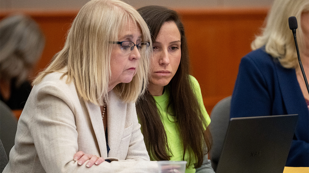 Kouri Richins speaks with attorney during sentencing hearing in Utah murder case