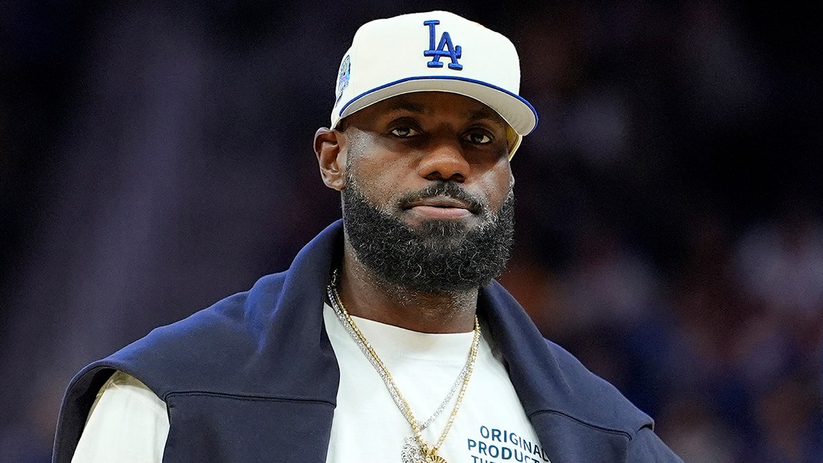 LeBron James looking on during a timeout in a basketball game at Chase Center