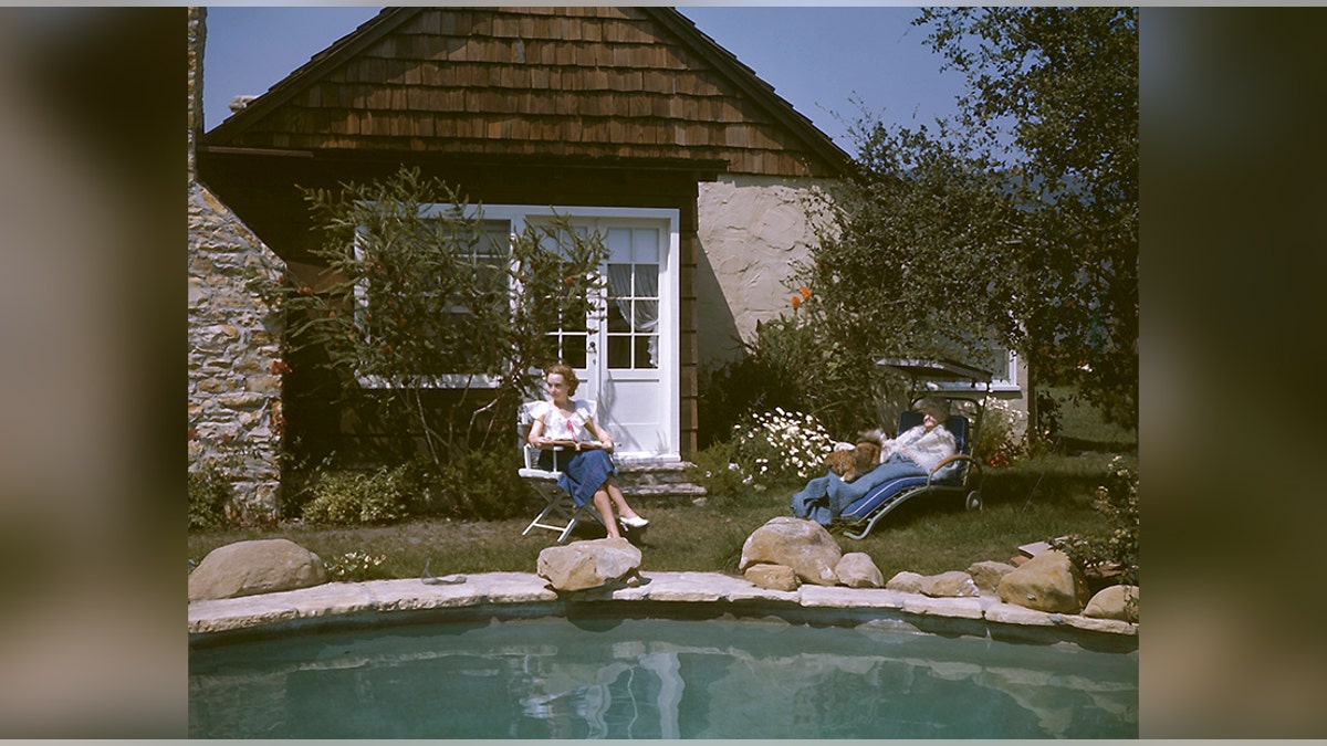 American actress Lillian Gish and her mother Mary Gish relaxing by a swimming pool