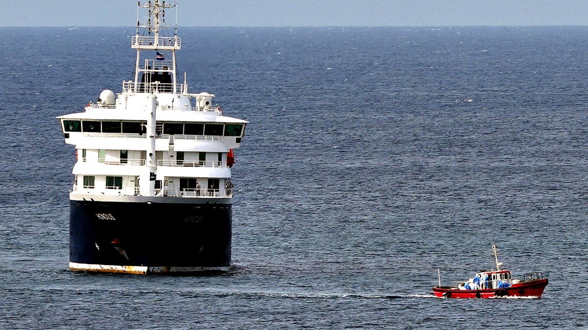The MV Hondius cruise ship anchored at a port in Praia, Cape Verde