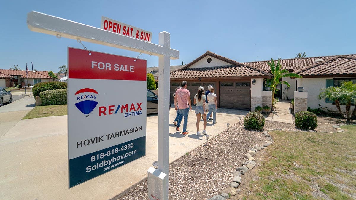 Prospective buyers arriving at an open house in Rancho Cucamonga California