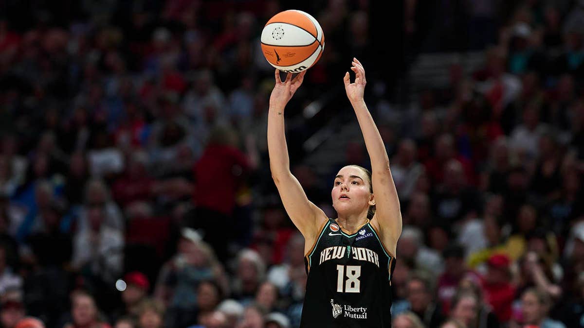 New York Liberty guard Pauline Astier shooting a three-point basket during a basketball game