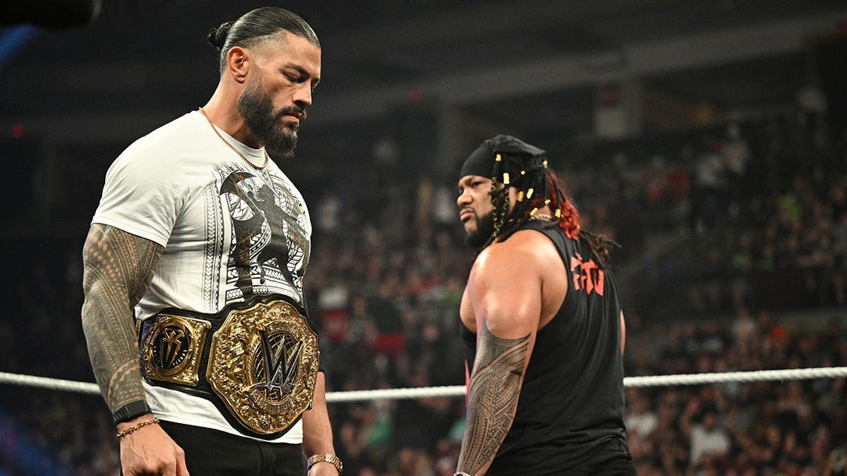 World Heavyweight Champion Roman Reigns wrestling Jacob Fatu in ring