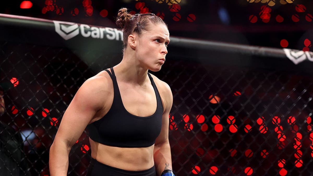 Ronda Rousey looking on before featherweight bout against Gina Carano at Intuit Dome