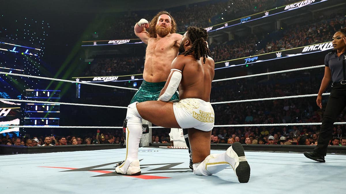 Sami Zayn wrestling Trick Williams in a WWE match at Benchmark International Arena