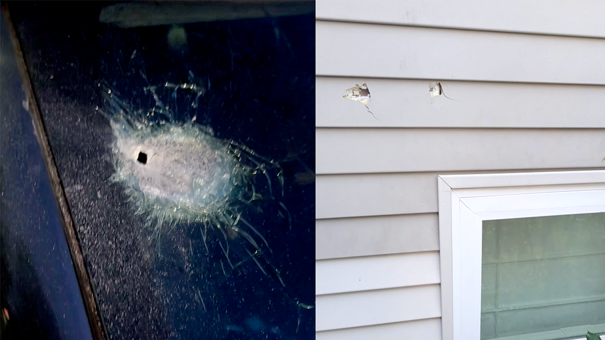 Bullet holes visible in a vehicle window and the siding of a Seattle home after a shooting near Aurora Avenue
