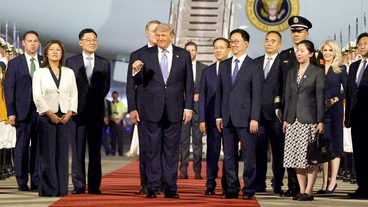 trump arrives in china greeted off air force 2