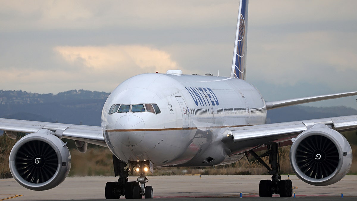 United Airlines plane flying in the sky