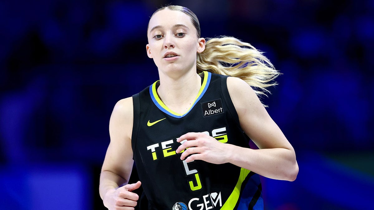 Dallas Wings guard Paige Bueckers dribbling basketball during game against Golden State Valkyries