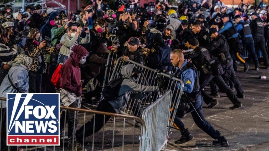 SEE IT: Rioters hurl rocks, try to breach barricades