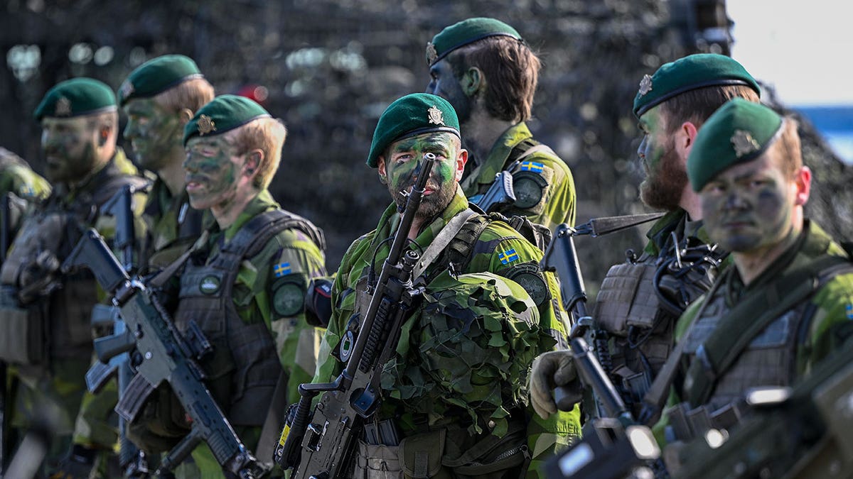 Swedish soldiers standing in formation at Berga naval base during military exercise Aurora 23