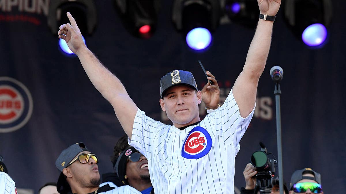 Chicago Cubs first baseman Anthony Rizzo celebrating at a World Series victory rally in Chicago