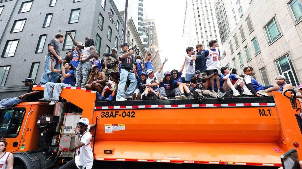 Knicks fans climb on police cars, sanitation trucks as countless others unable to get into jam-packed parade Knicks fans climb on police cars, sanitation trucks as countless others unable to get into jam-packed parade