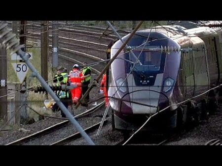 Driver dies and nine people are in critical condition after two trains collide in the UK
