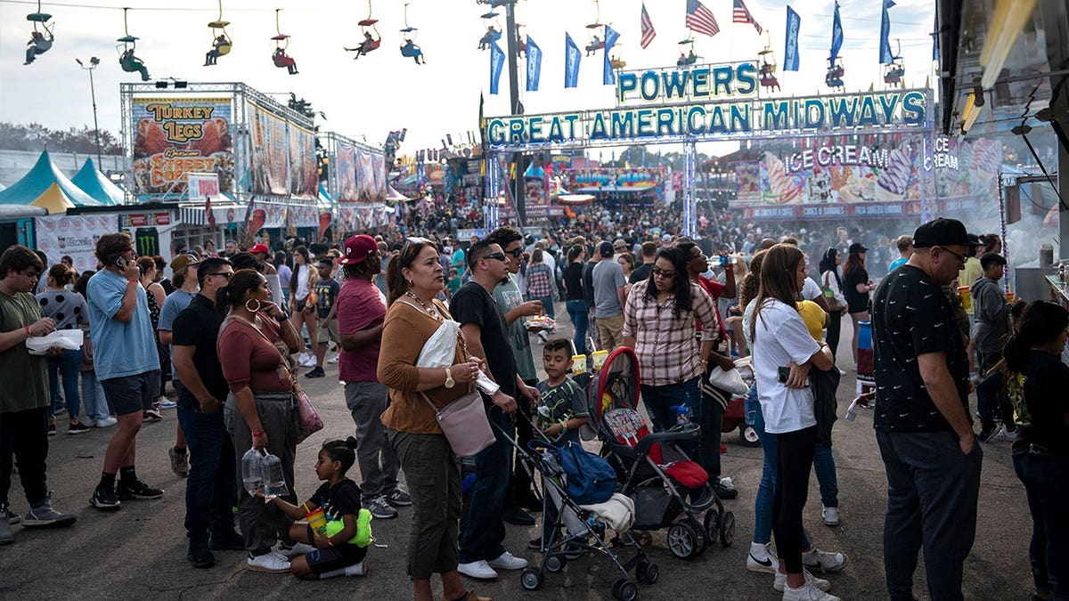 People standing outside food stalls at North Carolina State Fair