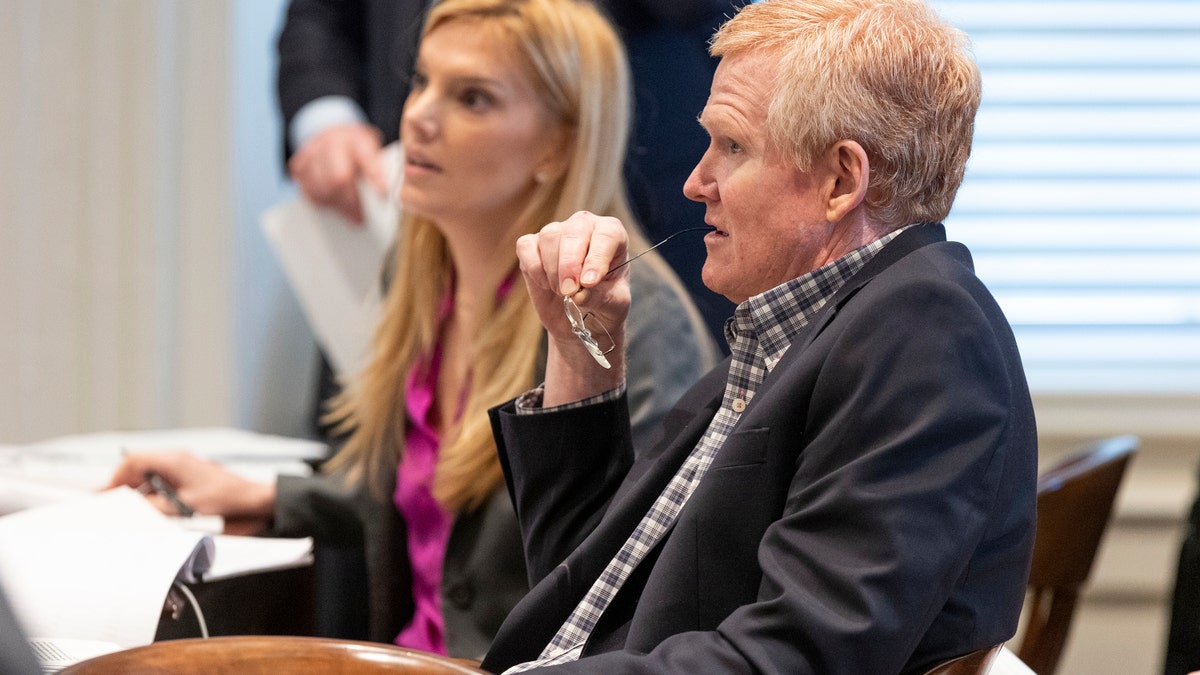 Alex Murdaugh sitting with legal team inside courtroom during jury selection