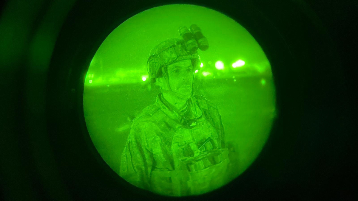 Maj. Gen. Christopher Donahue boards a C-17 cargo plane in Kabul, Afghanistan.