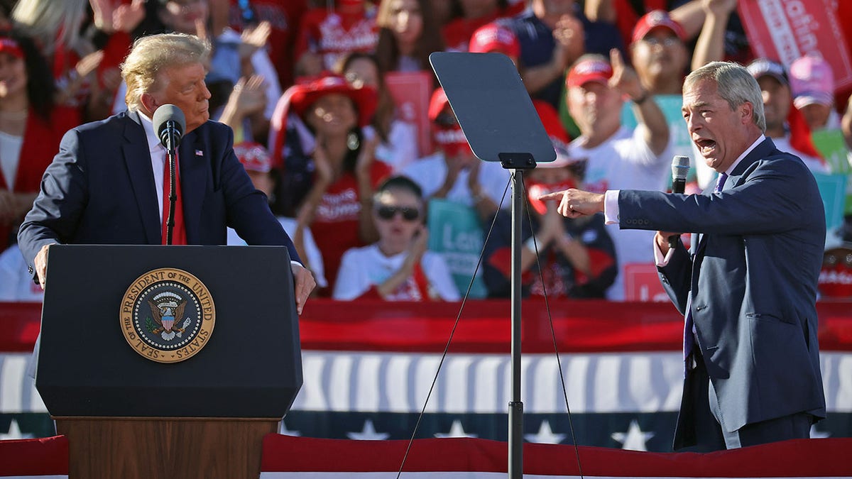 Nigel Farage and Donald Trump standing together at a campaign rally in Goodyear, Arizona.