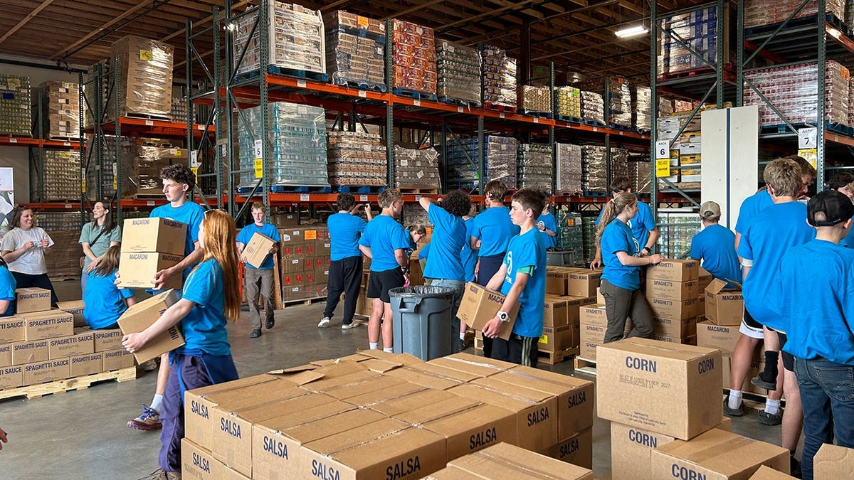 people organizing food delivery a warehouse in Alaska