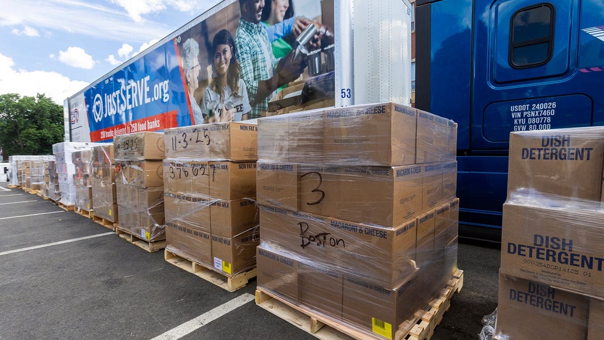 boxes of food and items are unloaded from a truck in Boston