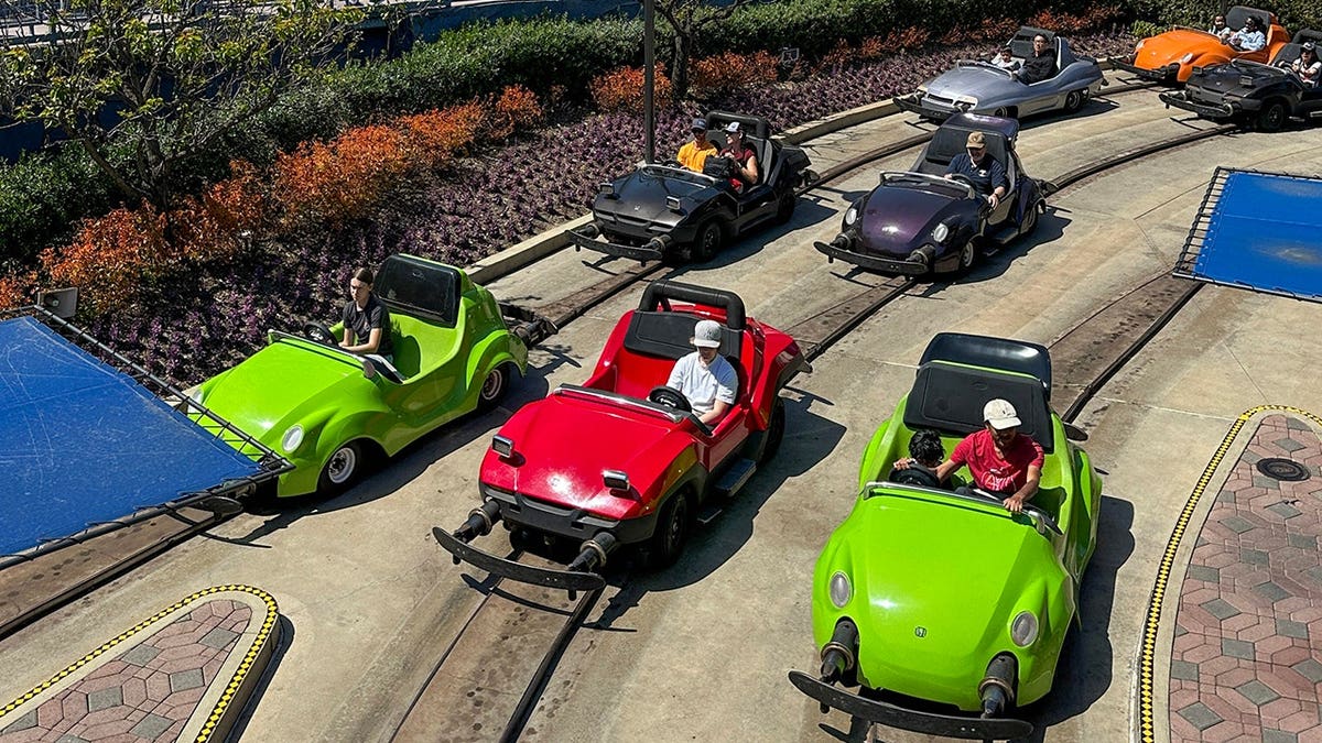 Autopia cars driving inside Tomorrowland at Disneyland in Anaheim, California