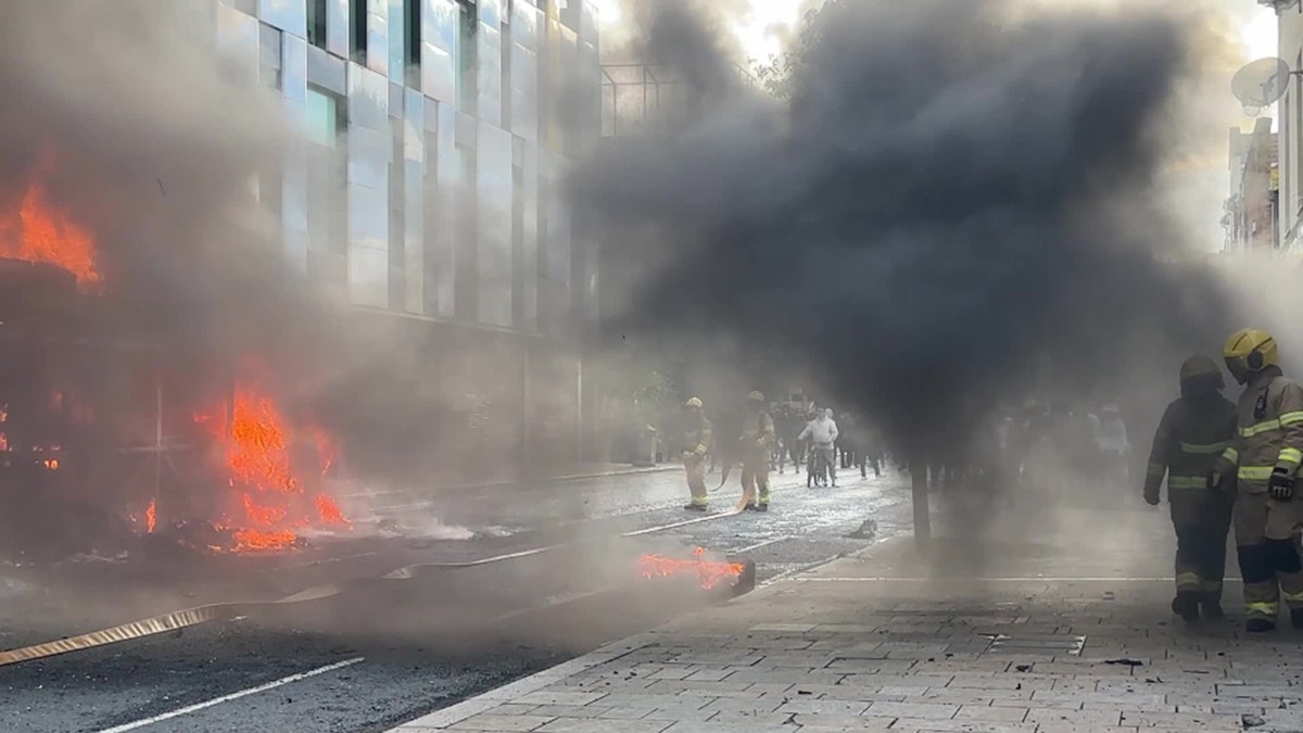 A Glider bus burning on Newtownards Road in east Belfast during a protest
