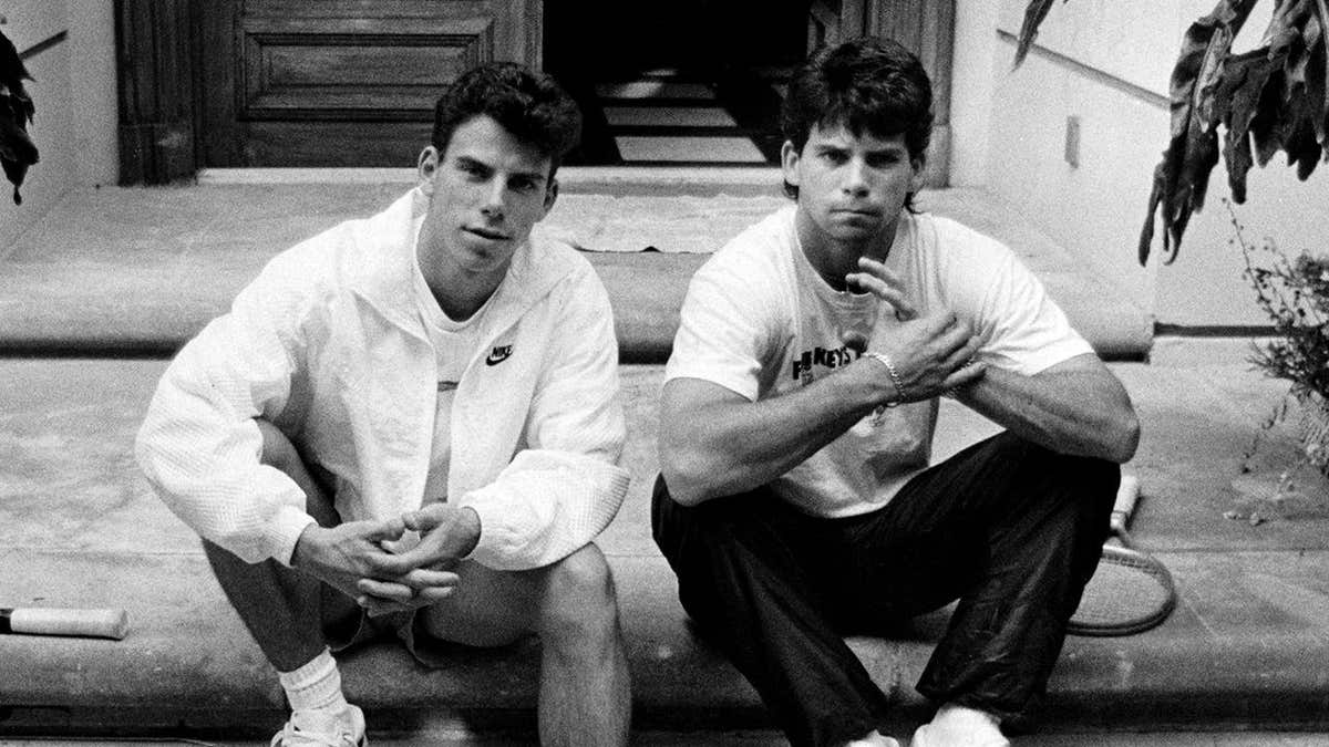 Erik and Lyle Menendez standing on the steps of their Beverly Hills home.