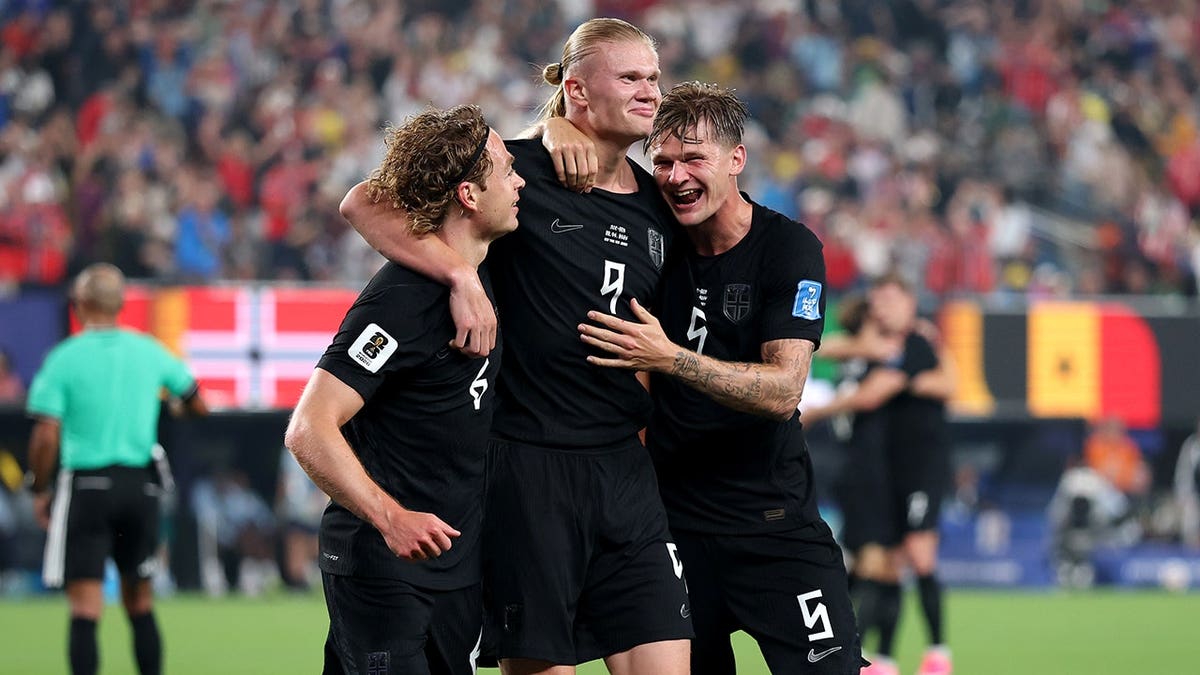 Erling Haaland celebrating with teammates after scoring a goal at New York New Jersey Stadium.