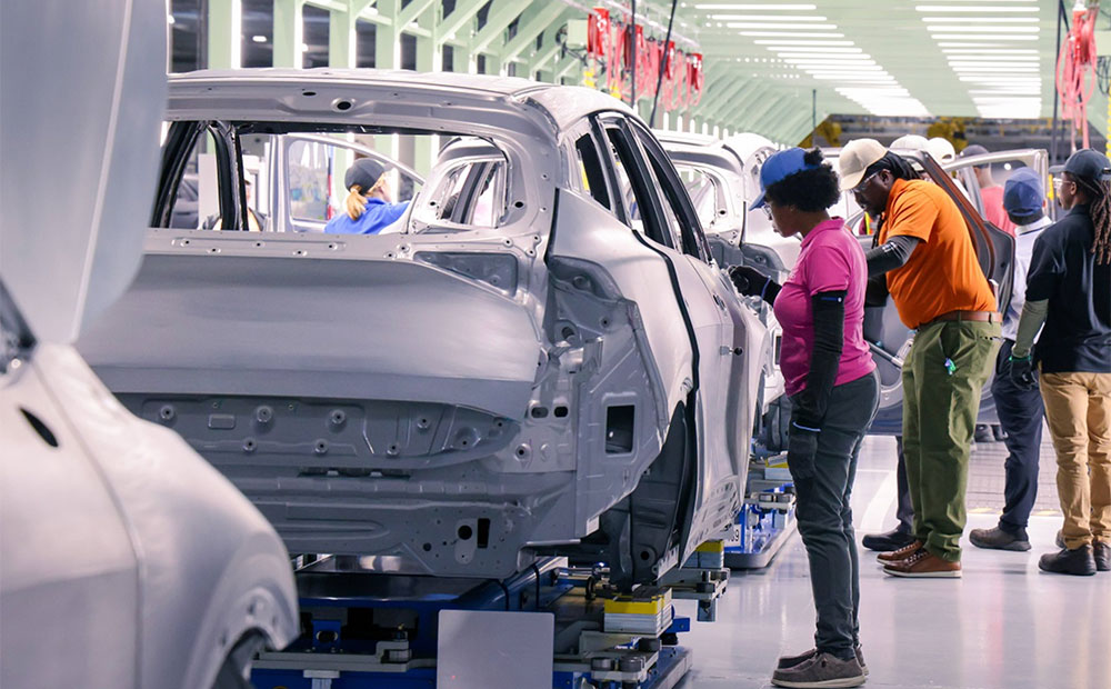 Workers assemble vehicle bodies on Hyundai Motor Group Metaplant America's flexible production line in Georgia.