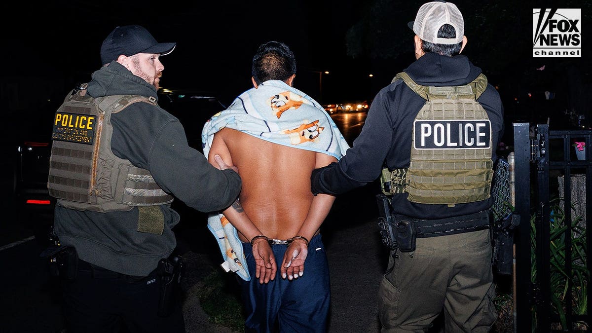 A man being arrested by ICE agents in Monassas, Virginia