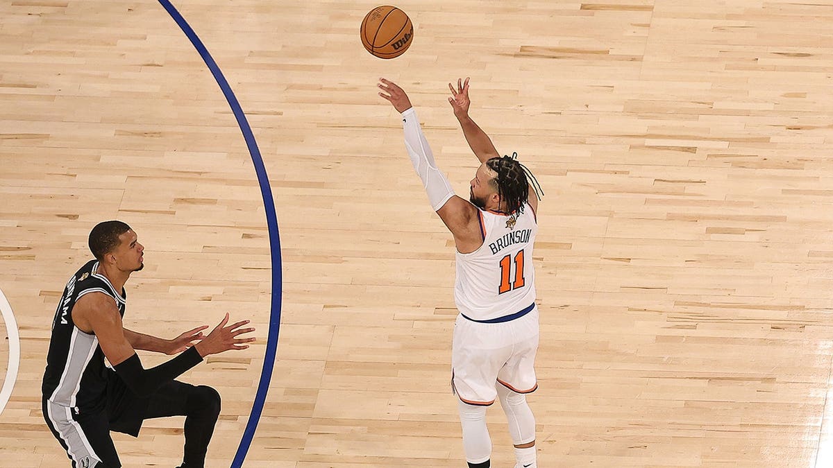 Jalen Brunson shooting a three-point basket over Victor Wembanyama at Madison Square Garden