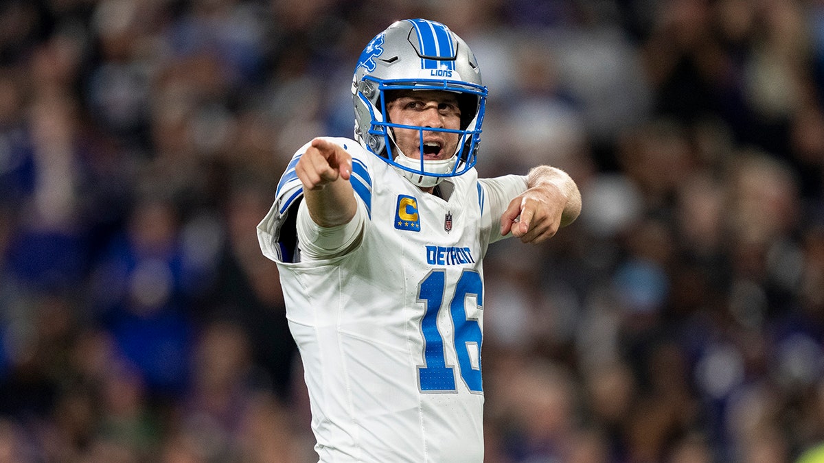 Jared Goff celebrating a touchdown on the field at M&T Bank Stadium.