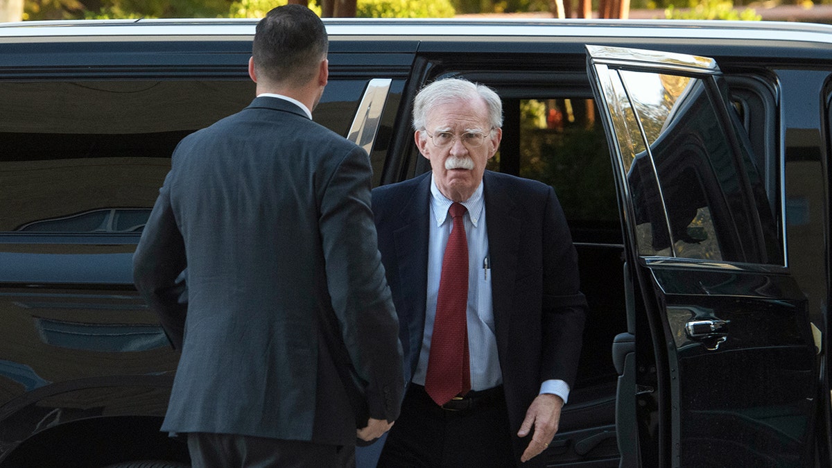 John Bolton exits vehicle arriving at Greenbelt Federal Courthouse in Maryland
