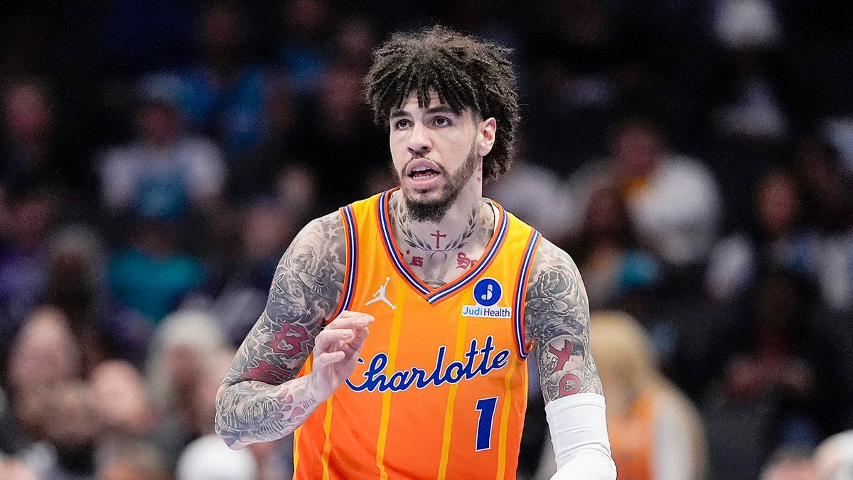 Charlotte Hornets guard LaMelo Ball dribbling the basketball upcourt against the Houston Rockets