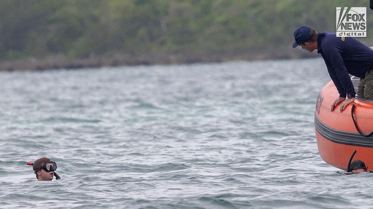 Members of the US Coast Guard searching waters near Hope Town, The Bahamas