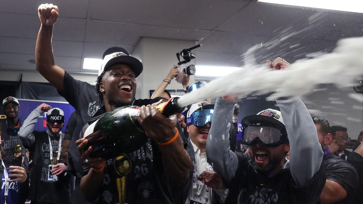 OG Anunoby celebrating on basketball court after NBA Finals win