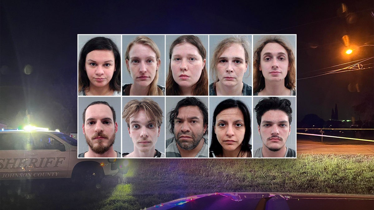 Ten suspects stand in two rows in front of a crime scene photo at Prairieland Detention Center Texas