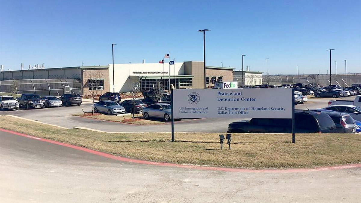 Law enforcement officers standing outside Prairieland Detention Center in Alvarado, Texas
