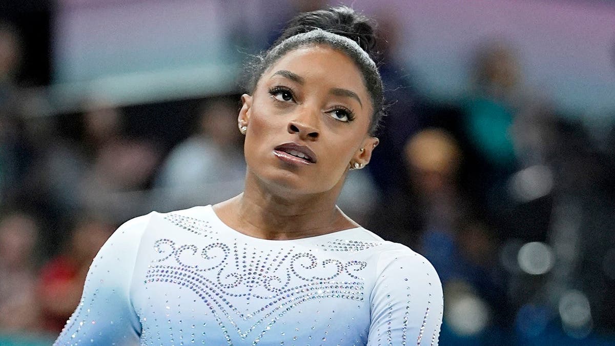 Simone Biles reacting after competing on the beam at the Paris Olympics.