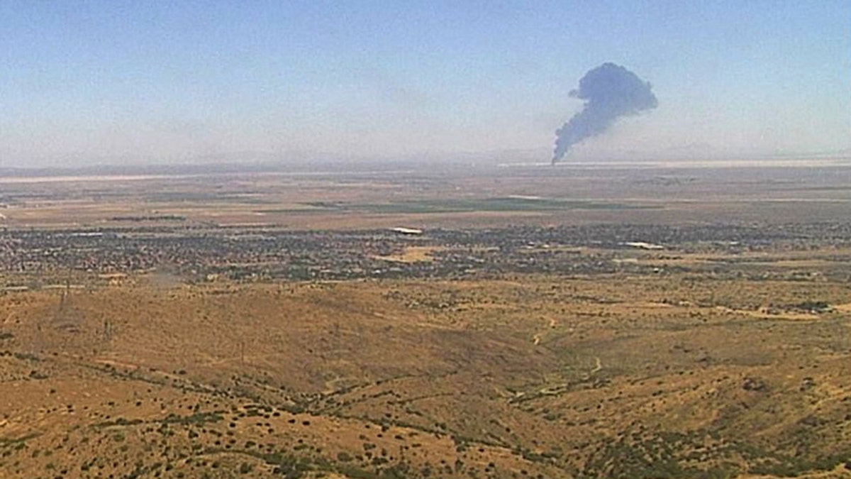 Smoke rises from Edwards Air Force Base after the crash of a U.S. Air Force B-52 bomber aircraft