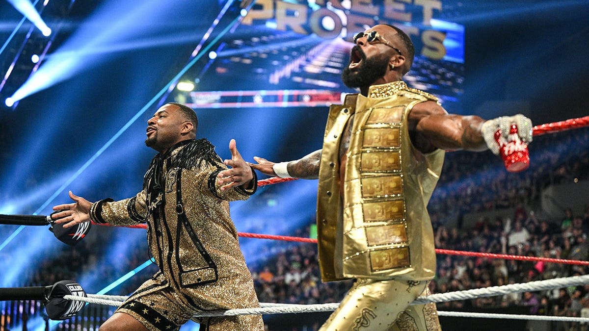 Angelo Dawkins and Montez Ford of the Street Profits entering the wrestling ring.