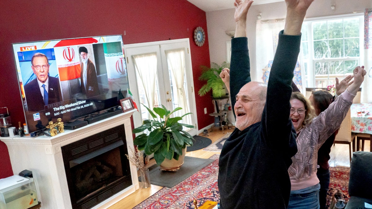 Sadaf Ebrahimi, Shirin Nariman, and Mehran Ebrahimi watching a TV screen in a home in Vienna, Virginia