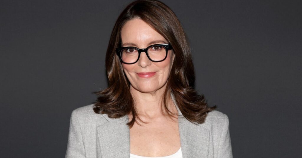 Tina Fey Made the ‘It’ Girl Red Sweater Trend Work for Summer, and Now We Want One Too