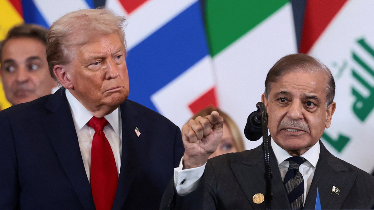 President Donald Trump looking at Pakistan's Prime Minister Shehbaz Sharif speaking in Egypt